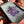 Load image into Gallery viewer, Sparkly Spinning Flower Pendant - Spring Purple
