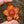 Load image into Gallery viewer, Sparkly Spinning Flower Pendant - Opaque Red/Orange w/ Cubic Zirconia Center
