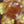 Load and play video in Gallery viewer, Sparkly Spinning Flower Pendant - Opaque Red/Orange w/ Cubic Zirconia Center

